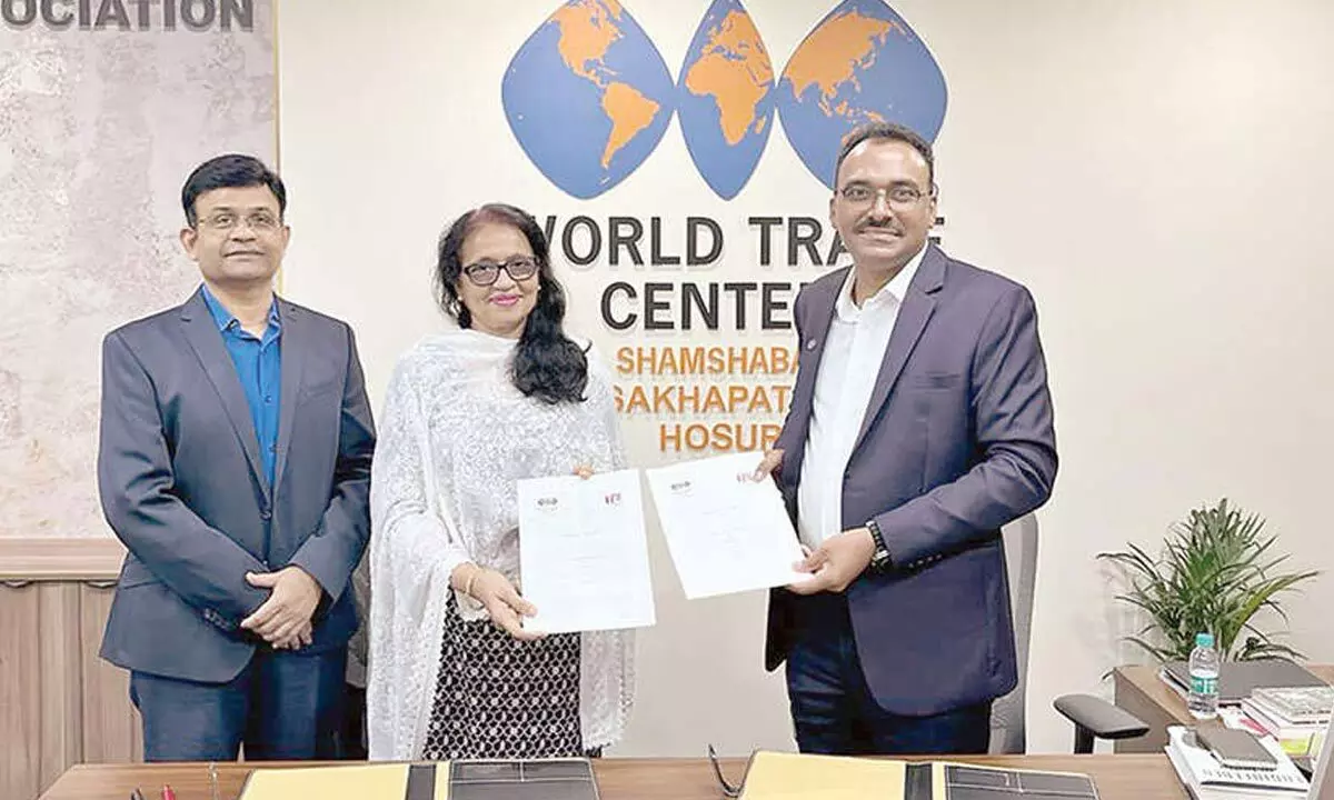 WTC Shamshabad Chairman Varaprasad Reddy and TiE Hyderabad President Rashida Adenwala exchanging MoU documents in Hyderabad on Tuesday