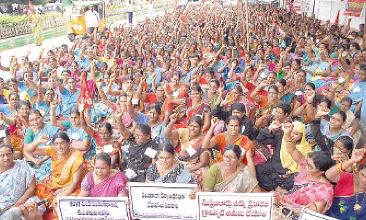 Anganwadi workers and helpers protesting in front of the collectorate in Ongole on Tuesday
