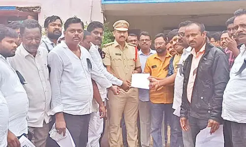 Journalists submitting a representation to Singarayakonda police personnel on Wednesday