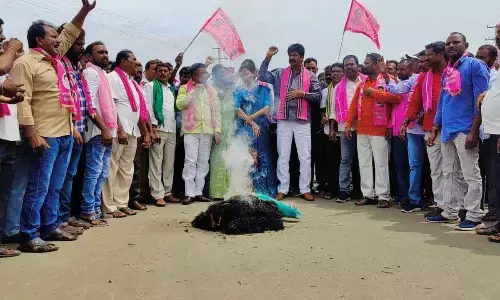 BRS cadres led by MLA Banoth Shankar Naik stage protest at Gudur in Mahabubabad district on Wednesday