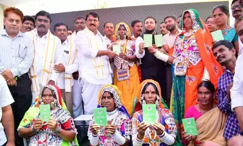 Niranjan distributes podu pattas to tribals