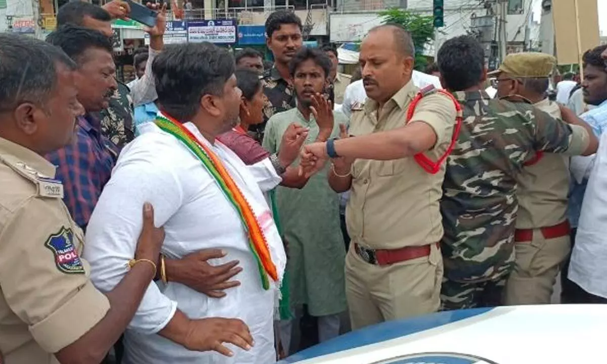 Police arresting Congress leader Rohit Rao in Karimnagar on Friday