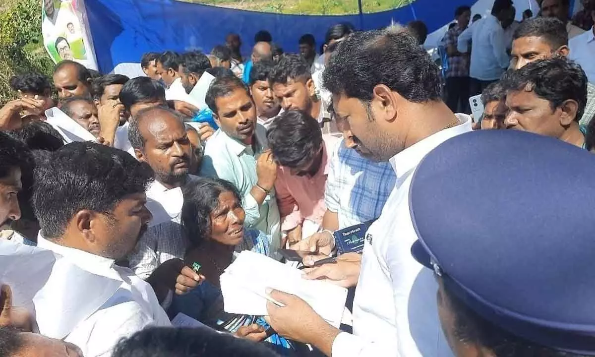 Kadapa MP Y S Avinash Reddy receiving representations from the people at Kanam Palle village in Pulivendula mandal on Friday.