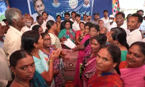 ZP chairperson Heny Christina distributing certificates to the beneficiaries at Jagananna Suraksha camp in Merikapudi village on Friday
