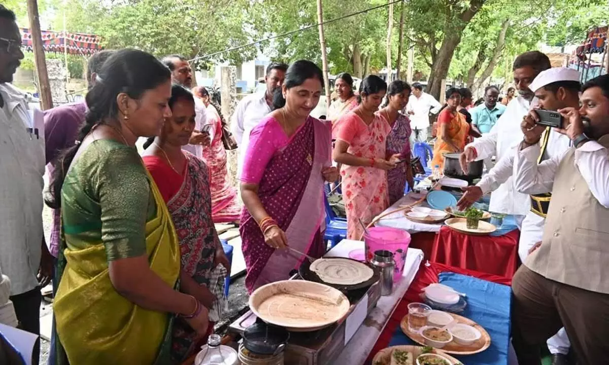 Collector Madhavi Latha making dosa in Rajamahendravaram on Sunday