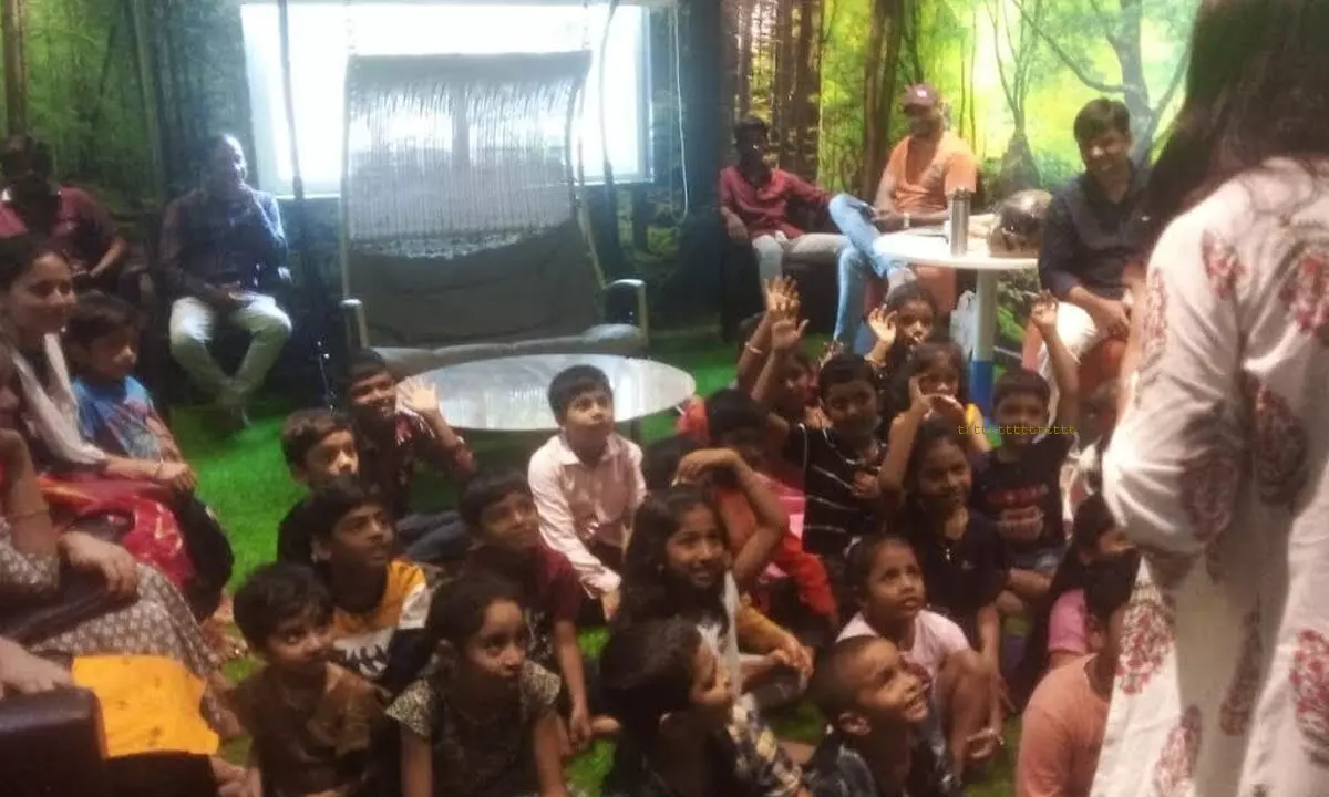 Children listening to a storytelling session at Miyawaki at Visakhapatnam Public Library on Sunday