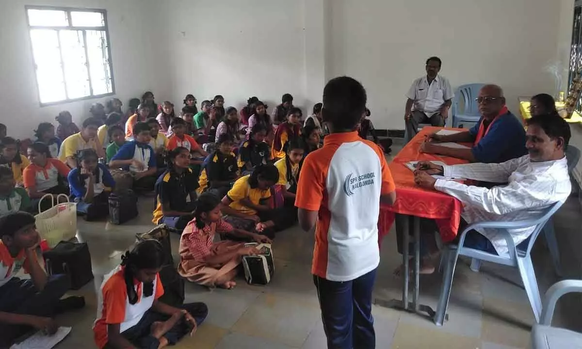 A student telling story at the storytelling competition held at TTD Kalayana mandapam in Nalgonda on Saturday