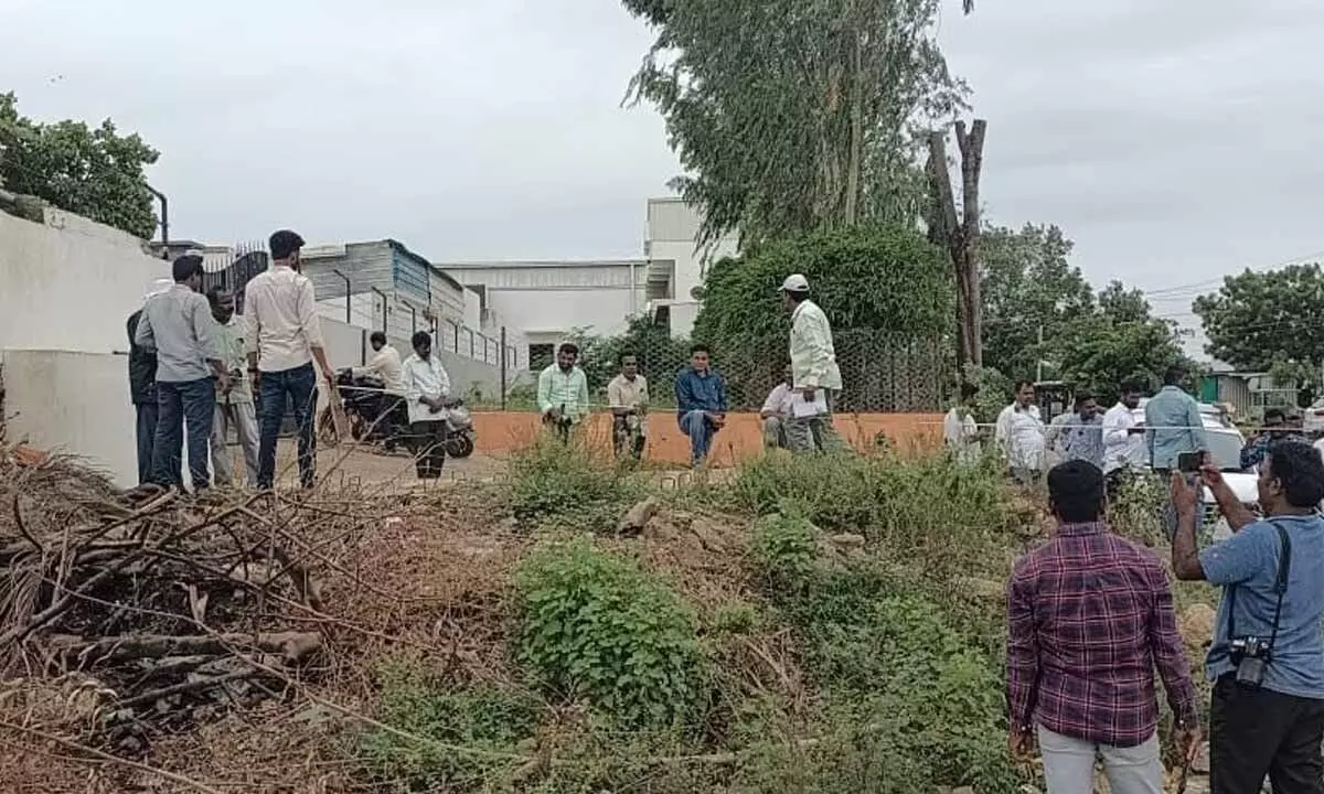 Officers conducting the survey in NSP lands in Khammam urban on Monday