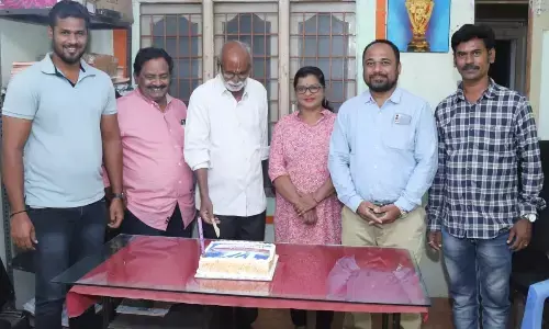 The Hans India special correspondent G Sridharan cutting the cake celebrating the 12th anniversary of the organisation in Tirupati on Sunday
