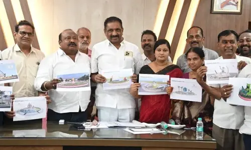 Minister G Kamalakar releasing models of traffic island junctions in Karimnagar on Monday