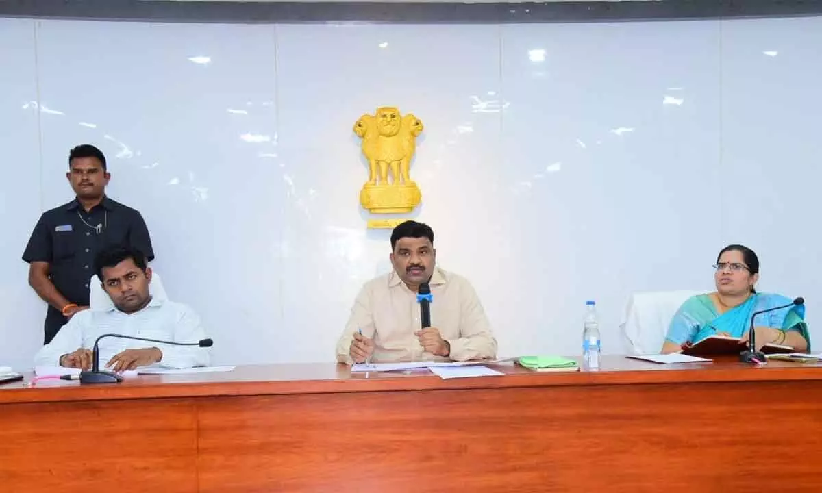 District Collector Ranjit Basha speaking at a review meeting at the Collectorate in Bapatla on Monday. Joint collector Ch Sridhar is also seen.