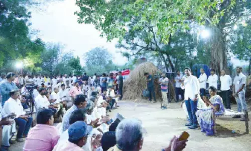 TDP general secretary Nara Lokesh speaking with dairy farmers during Rachhabanda at Malepadu village on Monday