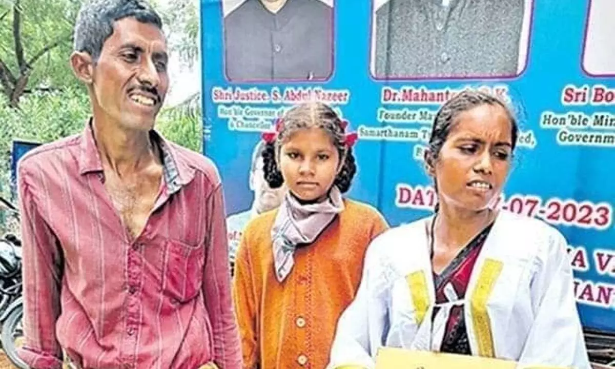 Bharathi along with her husband and daughter at SKU campus in Anantapur on Wednesday