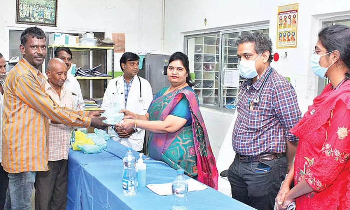 SVIMS Director Sada Bhargavi distributing free medicines to dialysis patients in Tirupati on Wednesday. SVIMS medical superintendent Dr R Ram is also seen.