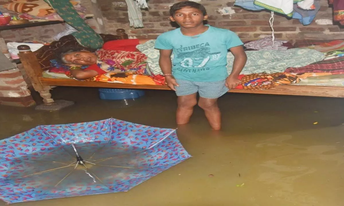 Rainwater entered houses at SR Nagar in Warangal on Thursday                    Photos: Shyam Kumar