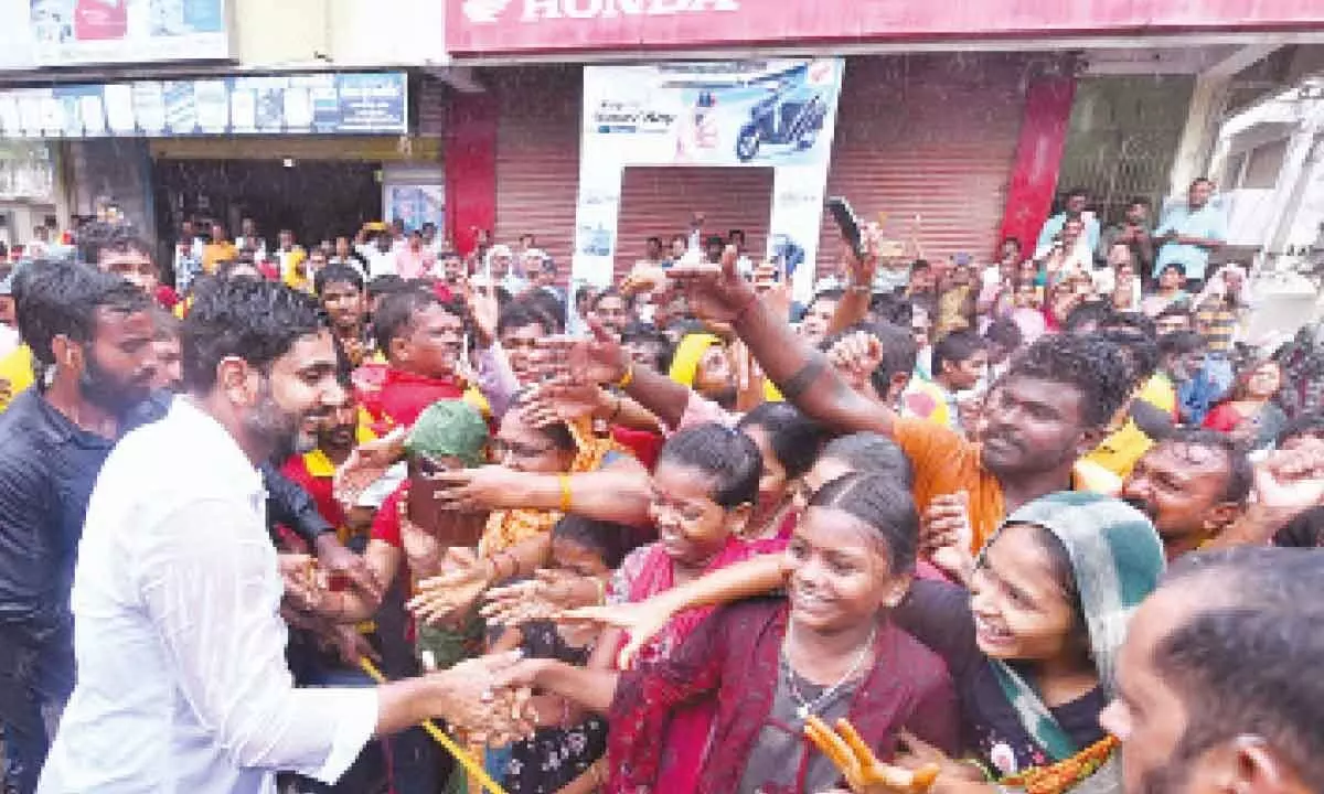 TDP general secretary Nara Lokesh shaking hands with the public in his Yuvagalam padayatra at Kanigiri on Thursday