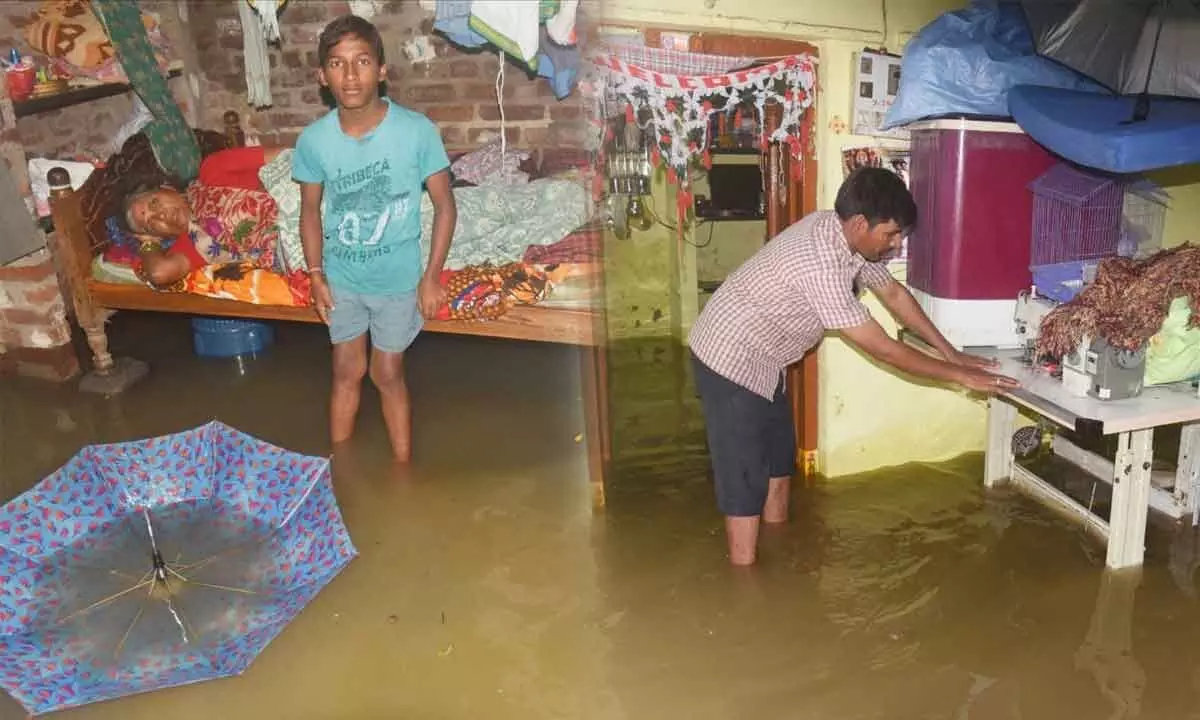 Rainwater entered houses at SR Nagar in Warangal on Thursday                    Photos: Shyam Kumar