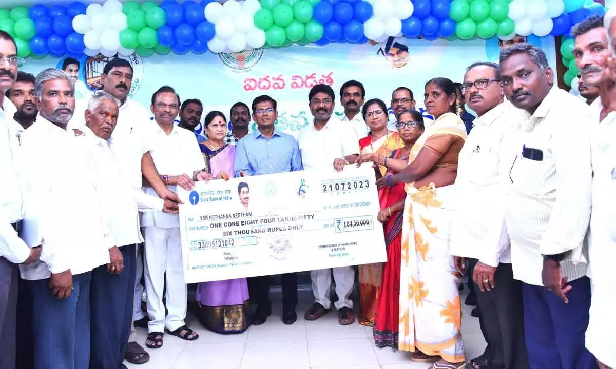 MA&JD Minister Dr Audimulapu Suresh, district Collector AS Diensh Kumar and ZP Chairperson Buchepalli Venkayamma handing over specimen cheque to the beneficiaries at Ongole Collectorate on Friday