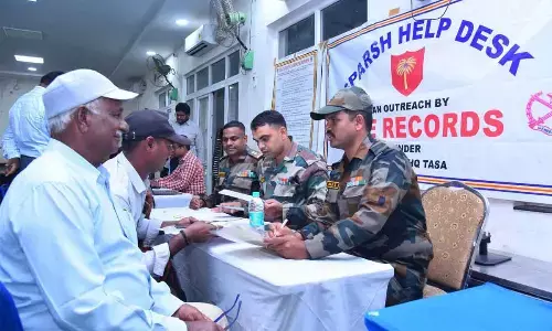 Defence pensioners from Prakasam district utilising the help desk to resolve their grievances related to SPARSH portal at Ongole on Friday