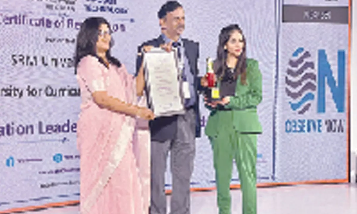 SRM University-AP Director of Communications Pankaj Belwariar receiving Promising University award on behalf of the University from Dr Anju Sharma, Additional Chief Secretary, Labour Department, Government of Gujarat and Taniya Tikoo, Editor-in-Chief of Observe Now, in Hyderabad