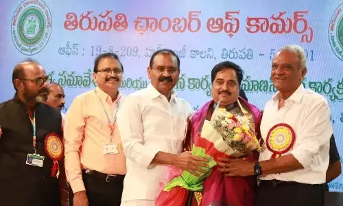 MLA Bhumana Karunakar Redy along with CPI National Secretary  K Narayana felicitating TCC new president Mohan Kumar Raju.