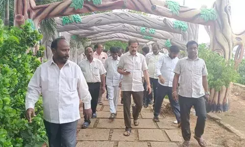 Chief Whip D Vinay Bhaskar inspecting beautification works at Waddepally lake in Hanumakonda on Sunday