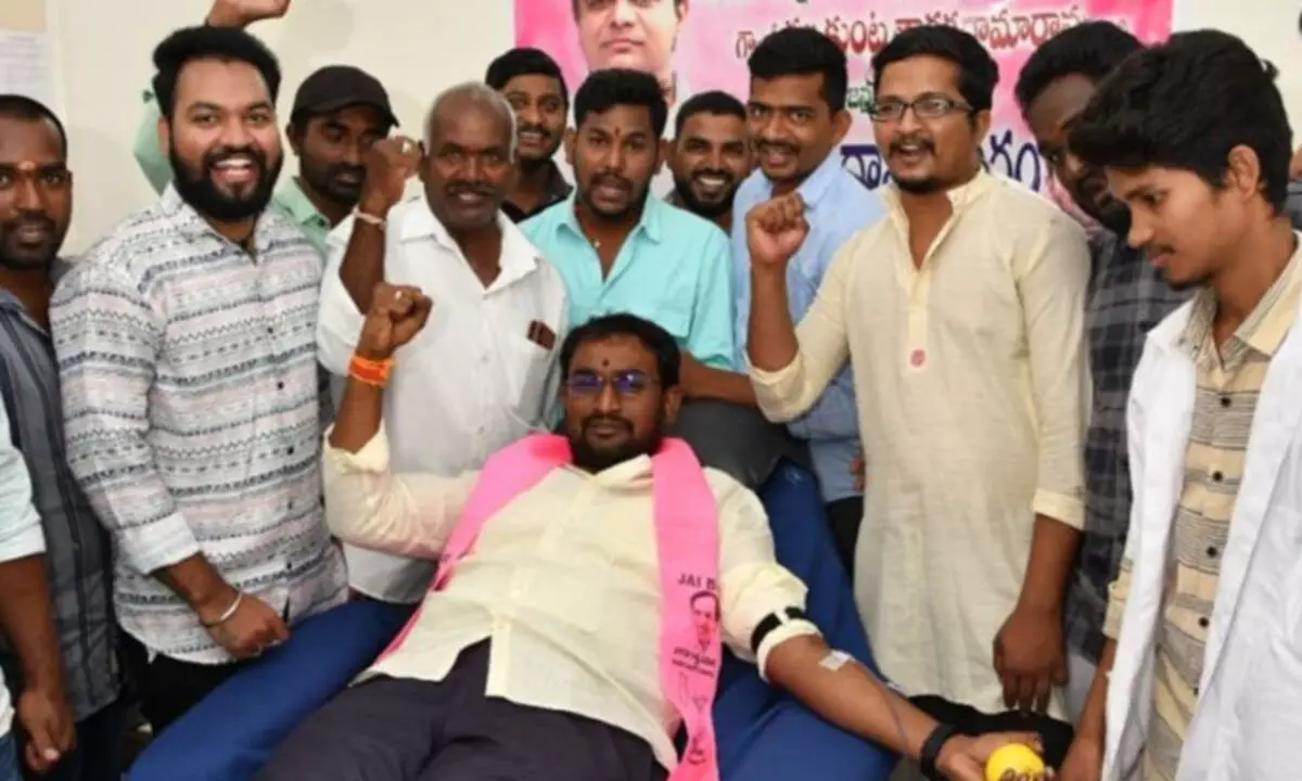 BRSV leader Jakkula Nagaraju Yadav along with 50 youths donated blood at the local Sircilla RBC blood bank on Monday
