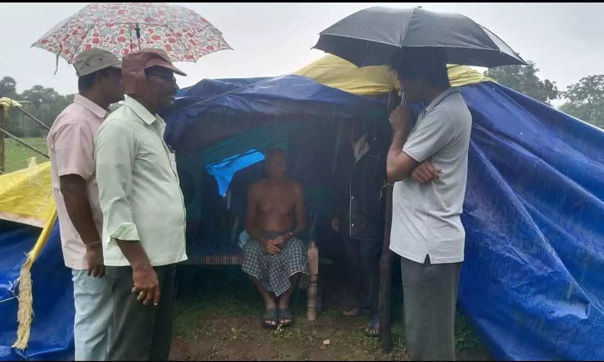 CPM leaders interacting with a victim at flood relief camp set up in VR Puram on Monday