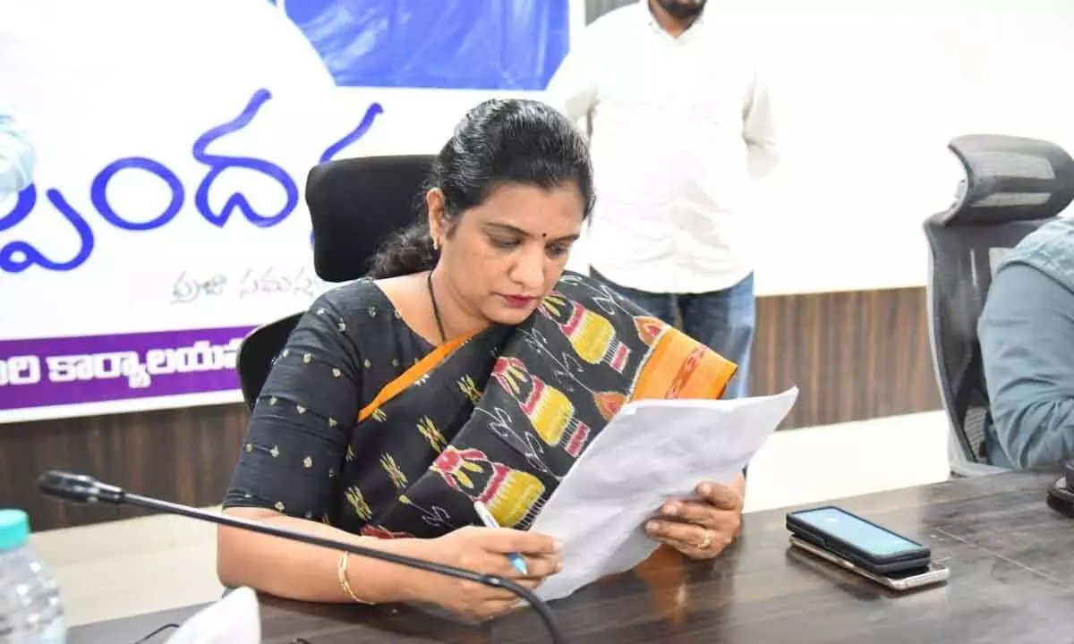 District Collector M Gautami going through the petitions presented to her at Spandana programme in Anantapur on Monday.