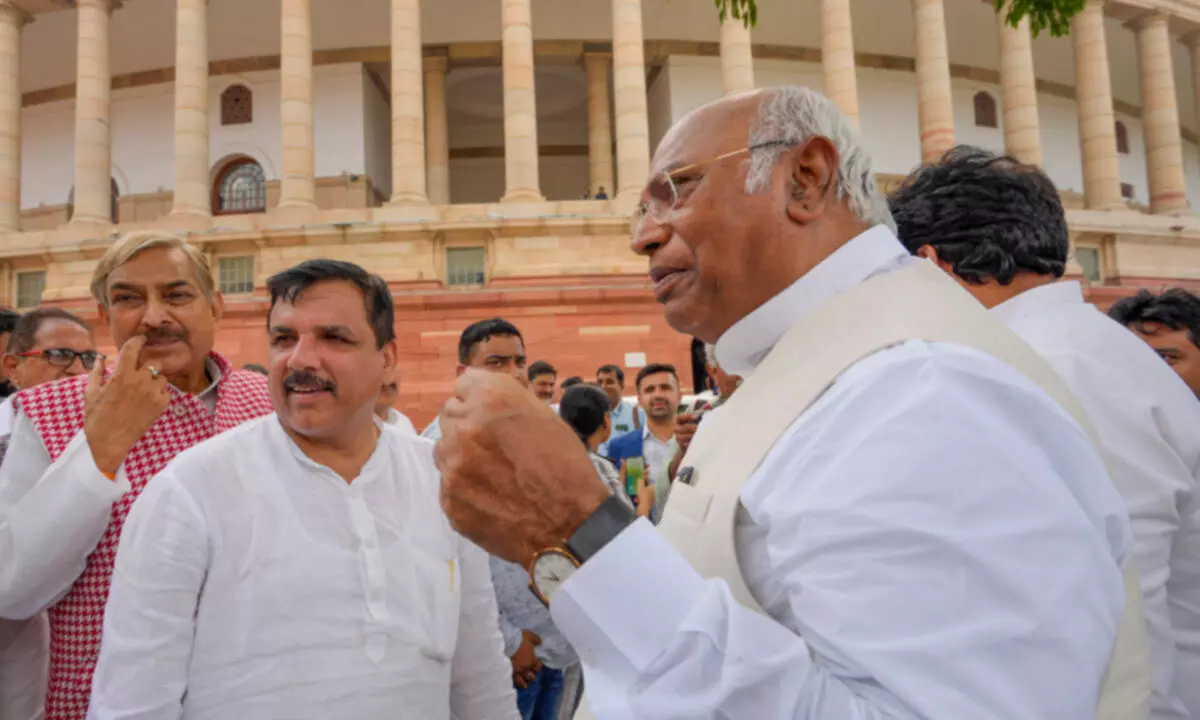 Congress President Mallikarjun Kharge meets AAP MP Sanjay Singh who is protesting over his suspension from Rajya Sabha