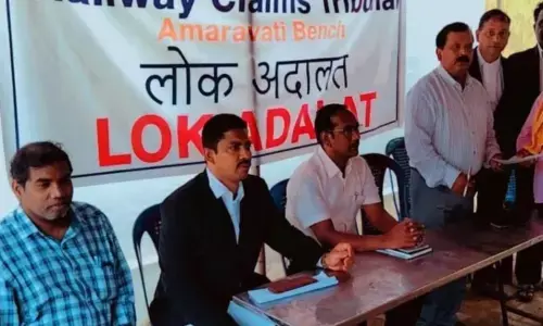 Gyan Prakash Tewari, Member (Judicial) of Amaravati Bench and others at Lok Adalat in Guntur on Tuesday