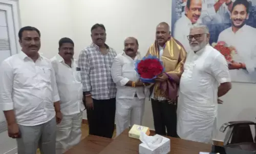 Guntur Mirchi Yard chairman Nimmakayala Rajnarayana felicitating MLC Lella Appi Reddy in Guntur on Tuesday. Minister for Water Resources Ambati Rambabu is also seen