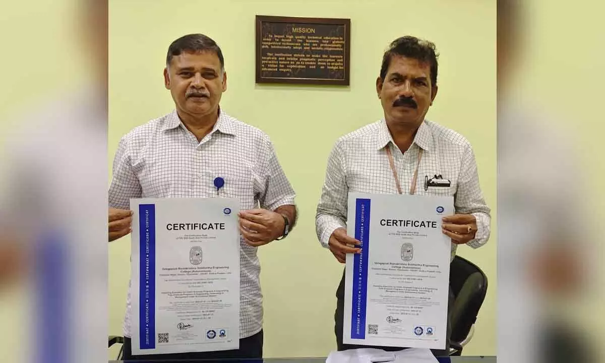 Dr Ch Srinivas, Dean (Industrial Relations) and Prof V Narasimha Rao, Head of the department of MBA and ISO coordinator showing the ISO Certification at VR Siddhartha Engineering College in Vijayawada on Wednesday