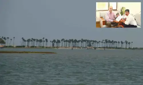Tirupati MP Dr M Gurumoorthy submitting a representation to the Joint secretary of the Ministry of Ports, Shipping and Waterways Bhushan Kumar at New Delhi. (Right) Pulicat Lake