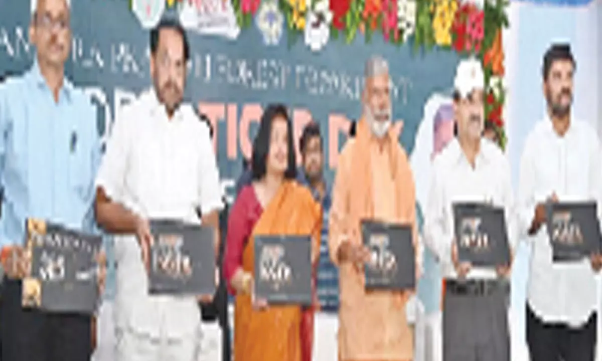 Minister for Forests and Environment Peddireddi Ramachandra Reddy and others releasing the Nagarjuna Sagar Srisailam Tiger Reserve book at SV Zoo Park in Tirupati on Saturday. PCCF Madhusudan Reddy, MPP Mohith Reddy and others are seen.