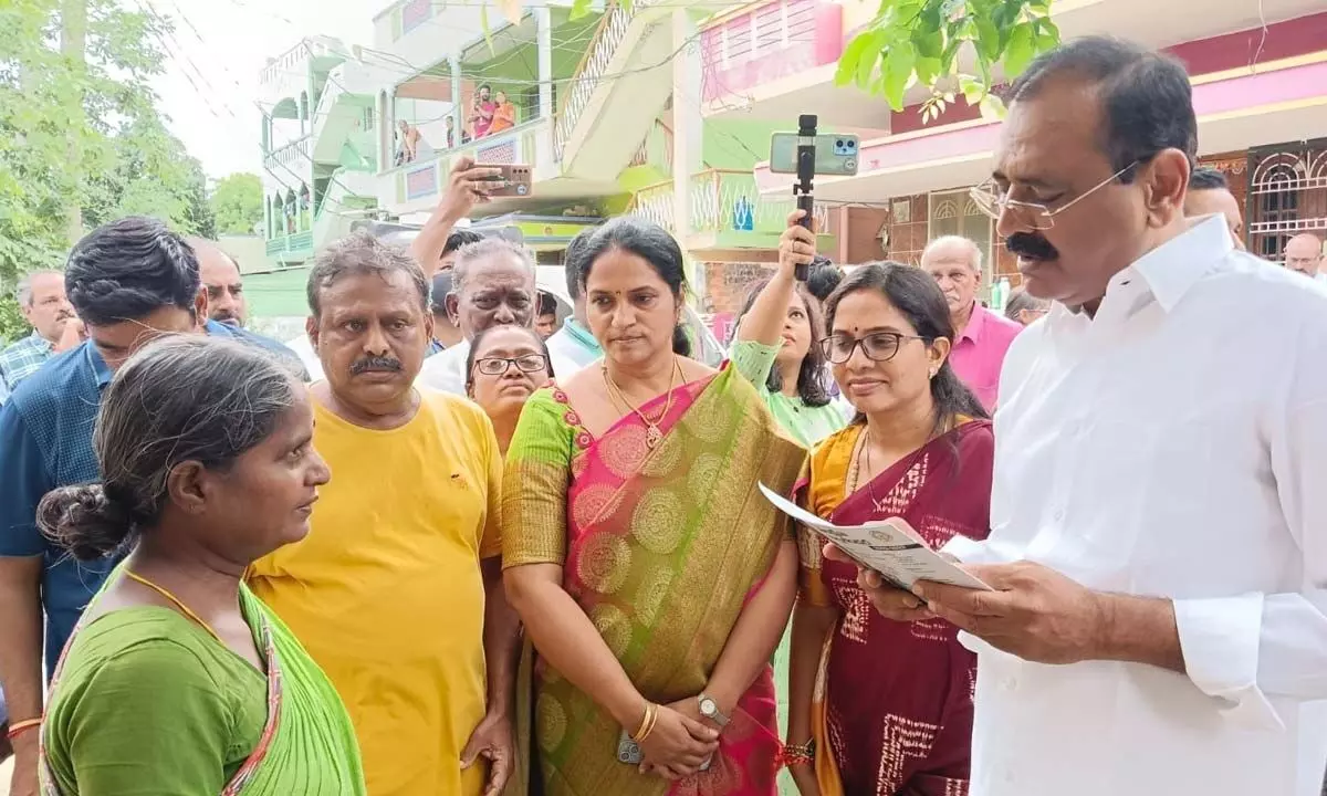 City MLA Bhumana Karunakar Reddy interacting with a woman during Gadapa-Gadapaku Mee Prabhutvam programme held at MR Palli in Tirupati on Saturday