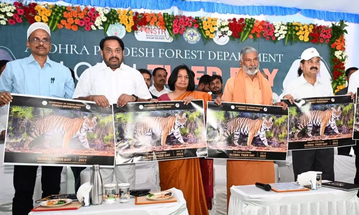 Minister for Forests and Environment Peddireddi Ramachandra Reddy and others releasing the Nagarjuna Sagar Srisailam Tiger Reserve book at SV Zoo Park in Tirupati on Saturday. PCCF Madhusudan Reddy, MPP Mohith Reddy and others are seen.