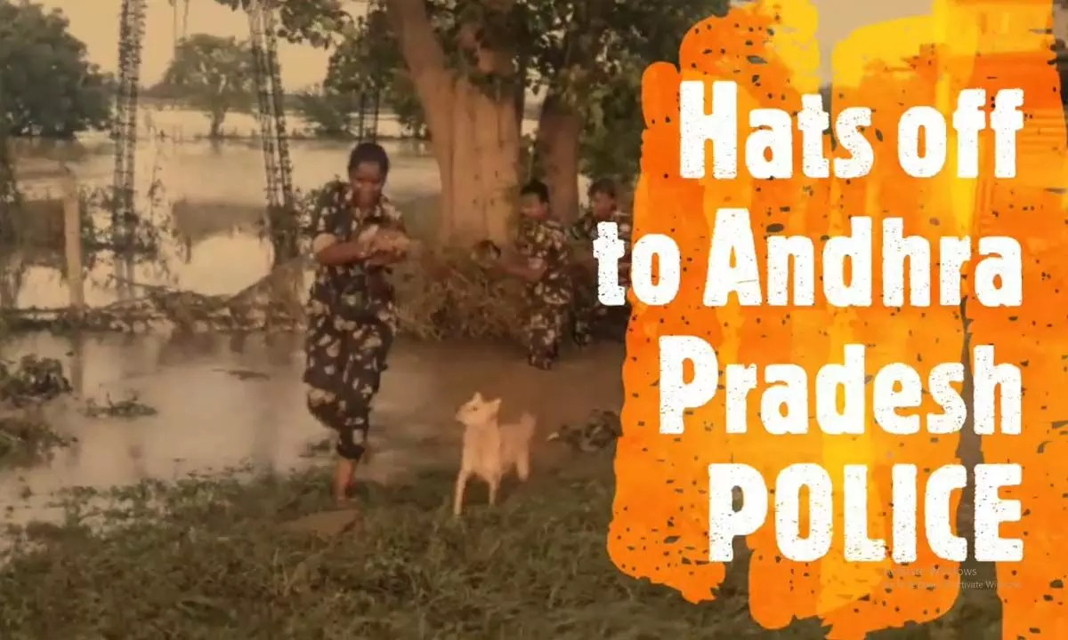 AP police rescue puppies stranded in flood and unites with mother dog in NTR district