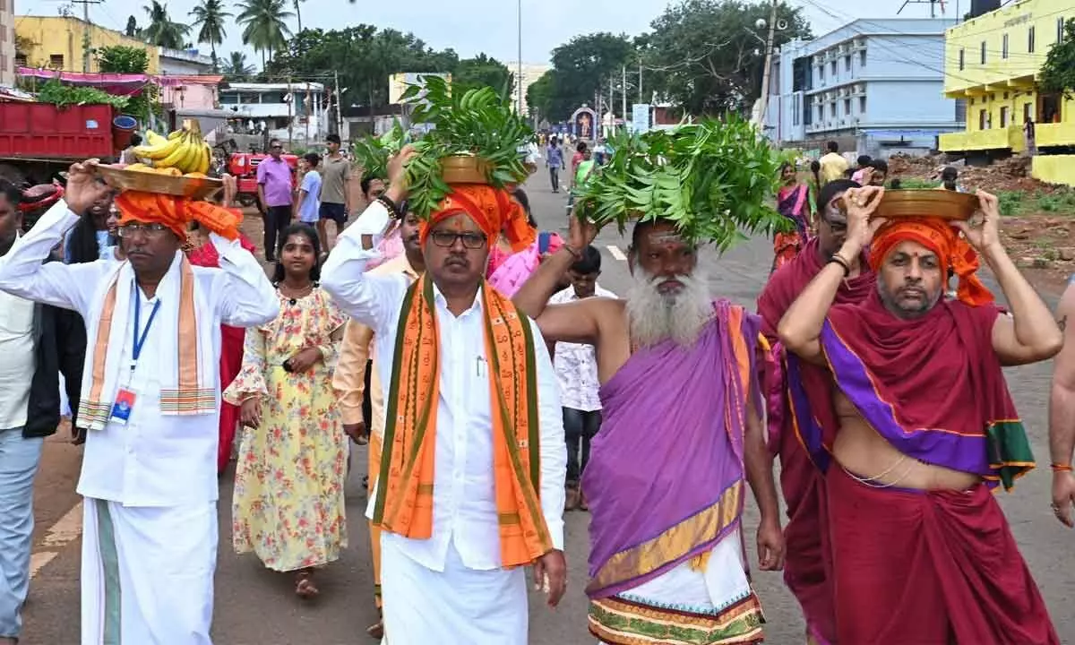 Srisailam Temple EO S Lavanna and others carrying Bonam to present to village Goddess Ankalamma in Srisailam on Sunday