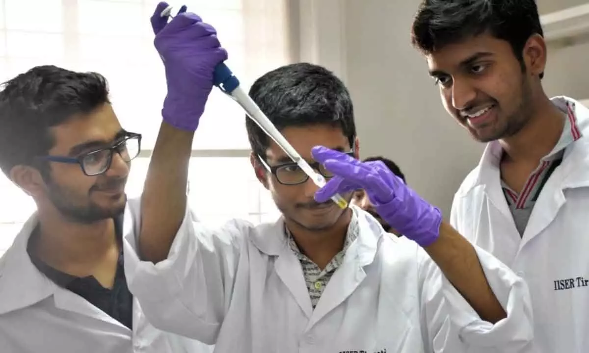 A group of students making chemistry experiments during the camp in Tirupati on Sunday