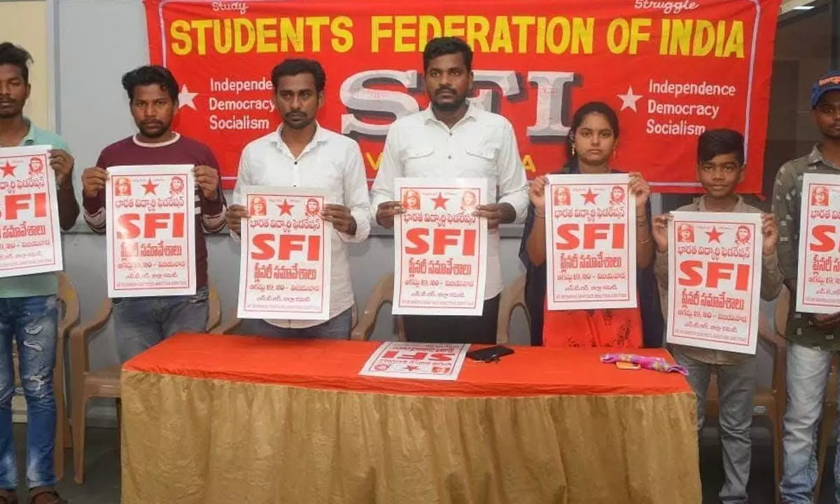 SFI leaders releasing wall posters of the forthcoming plenary meeting in Vijayawada on Monday