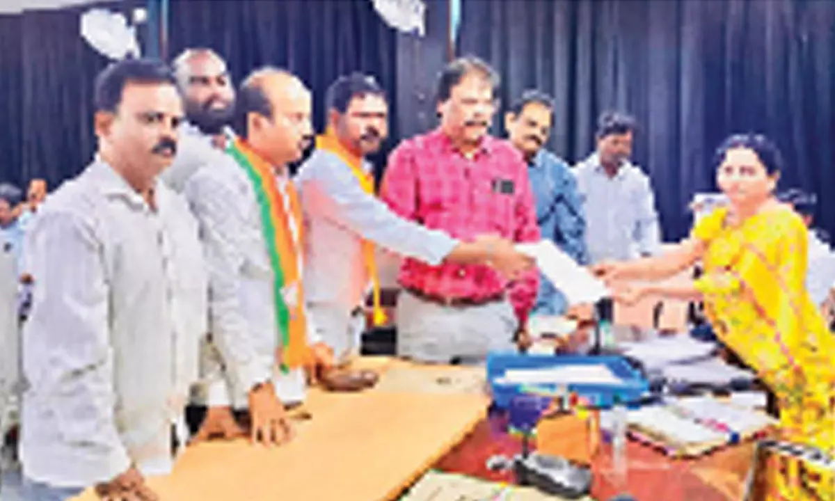 BJP leaders Dr Sreehari Rao, S Srinivas, K Ajay Kumar and  others submitting a representation to Sunitha, Additional  Commissioner of Municipal Corporation, in Tirupati on Monday