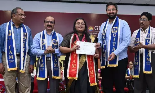 GITAM president M Sribharath giving away certificates to the students at the graduation ceremony held in Visakhapatnam