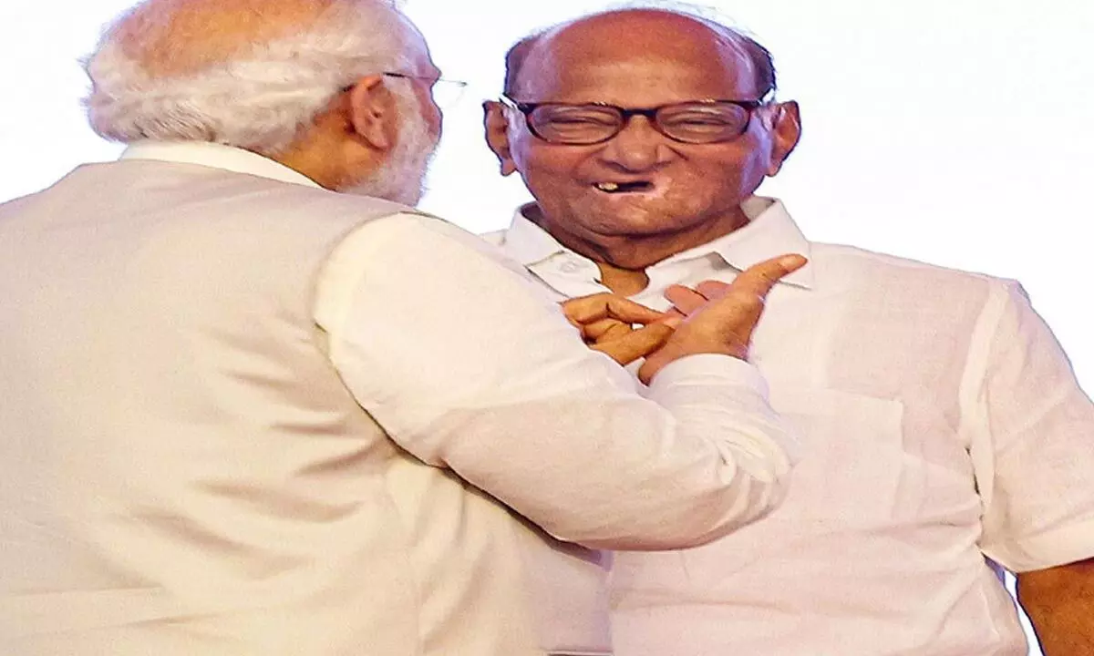 Prime Minister Narendra Modi interacts with NCP chief Sharad Pawar during the Lokmanya Tilak National Award ceremony, in Pune on Tuesday