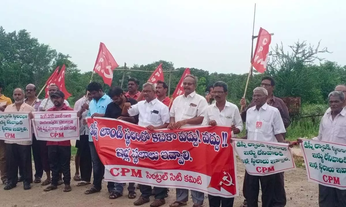 CPM leader Ch Babu Rao and others staging a protest at Ajit Singh Nagar in Vijayawada on