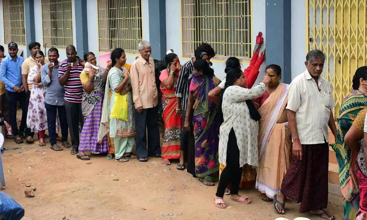 People waiting in queue to purchase subsidised tomatoes at Kedareswara Peta Rythu Bazar In Vijayawada on Wednesday Photo: Ch Venkata Mastan