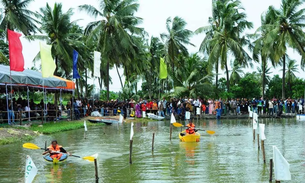 Students participating in Canoe competition at Shri Vishnu Engineering College for Women campus at Yanamadurru on Wednesday