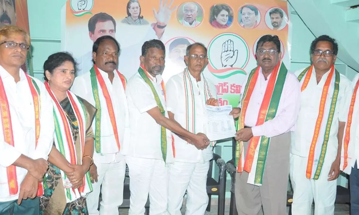 District Congress president S Martin Luther handing over appointment letters to K Srihari Babu and M Rammohan Rao at a meeting in Rajamahendravaram on Wednesday