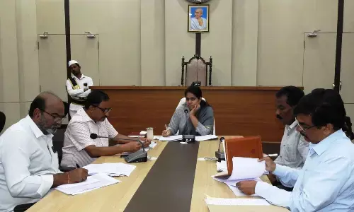 GMC Commissioner Keerthi Chekuri addressing a meeting in Guntur on Wednesday