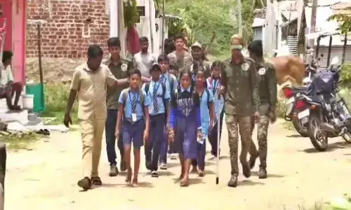Forest officials escorting students to schools